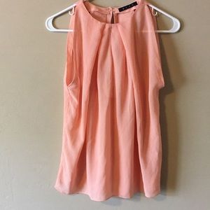 Light-colored orange blouse from BLVD